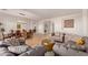 Inviting living room with modern furnishings and an open layout connecting to the dining area at 14022 W Hope Dr, Surprise, AZ 85379