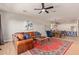 Bright open-concept living area showcasing a kitchen, living room, and dining space at 14022 W Hope Dr, Surprise, AZ 85379