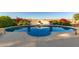 Beautiful pool with a spa and desert landscaping at 14022 W Hope Dr, Surprise, AZ 85379