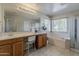 Bright bathroom featuring double vanity, soaking tub and walk-in shower at 14874 W Laurel Ln, Surprise, AZ 85379