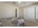 Bright bedroom features a walk in closet, neutral paint, carpet and a large window at 14874 W Laurel Ln, Surprise, AZ 85379