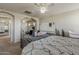 Bright primary bedroom featuring several doorways and natural lighting at 14874 W Laurel Ln, Surprise, AZ 85379