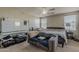 Bright primary bedroom featuring a sitting area and neutral decor at 14874 W Laurel Ln, Surprise, AZ 85379