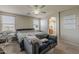 Primary bedroom featuring an archway, lots of natural light, and neutral decor at 14874 W Laurel Ln, Surprise, AZ 85379