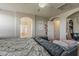 Bright primary bedroom featuring an archway and neutral decor at 14874 W Laurel Ln, Surprise, AZ 85379