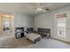 Bonus room featuring carpet, a ceiling fan, and a back door; ready for your creative vision at 14874 W Laurel Ln, Surprise, AZ 85379