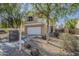 Two-story home with a two-car garage and desert landscaping at 14874 W Laurel Ln, Surprise, AZ 85379