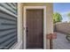 Close-up of the front door with a welcome sign and textured wall at 14874 W Laurel Ln, Surprise, AZ 85379