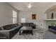 The cozy living room is complete with a ceiling fan, and offers lots of comfortable seating at 14874 W Laurel Ln, Surprise, AZ 85379
