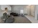 Open living room with neutral tones, carpet, and a view of the entryway at 14874 W Laurel Ln, Surprise, AZ 85379