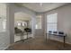 Open concept area connecting living spaces with tile floors at 14874 W Laurel Ln, Surprise, AZ 85379