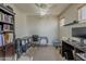 Cozy office space with desk, ceiling fan, and natural light at 14874 W Laurel Ln, Surprise, AZ 85379