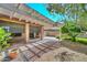 Relaxing covered back patio with stone flooring, desert landscaping, and plenty of shade at 15035 W Indianola Ave, Goodyear, AZ 85395
