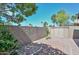 Landscaped backyard with a shed and a tall block wall for privacy at 15035 W Indianola Ave, Goodyear, AZ 85395