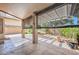 Spacious covered patio with stone flooring, creating a perfect spot for outdoor entertaining and relaxation at 15035 W Indianola Ave, Goodyear, AZ 85395
