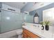 Clean bathroom with a tub and shower combination, bright lighting, and ample counter space at 15035 W Indianola Ave, Goodyear, AZ 85395