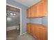 The bathroom area features a bath and shower combination and built in wall storage cabinets at 15035 W Indianola Ave, Goodyear, AZ 85395