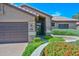 Inviting home featuring a well-manicured yard, a front-facing two-car garage, and excellent curb appeal at 15035 W Indianola Ave, Goodyear, AZ 85395