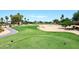 Lush golf course with sand traps, mature trees, and well-maintained green lawns at 15035 W Indianola Ave, Goodyear, AZ 85395