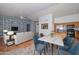 Open-concept living room and kitchen with hardwood floors and modern finishes create a bright and inviting space at 15035 W Indianola Ave, Goodyear, AZ 85395