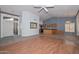 Inviting living room with high ceilings and an open layout leading to the kitchen at 15035 W Indianola Ave, Goodyear, AZ 85395