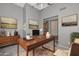 Well-appointed home office featuring a spacious desk and elegant decor offers a productive and stylish workspace at 15035 W Indianola Ave, Goodyear, AZ 85395
