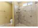 Modern bathroom showcasing a glass-enclosed shower with updated fixtures and tile surround at 15619 N 58Th Ave, Glendale, AZ 85306