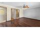Spacious bedroom with hardwood floors, access to the bathroom, and ample natural light at 15619 N 58Th Ave, Glendale, AZ 85306
