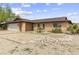 Traditional brick home with desert landscaping and a two-car garage at 15619 N 58Th Ave, Glendale, AZ 85306