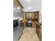 Well-equipped kitchen featuring granite countertops, stainless steel appliances, and abundant wood cabinetry at 15619 N 58Th Ave, Glendale, AZ 85306