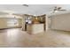 Open kitchen area featuring stainless steel appliances, tile floors, and a breakfast bar at 15619 N 58Th Ave, Glendale, AZ 85306