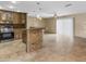 Updated kitchen with bar seating, stainless steel appliances, tile floors and modern lighting at 15619 N 58Th Ave, Glendale, AZ 85306