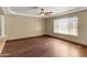 Spacious living room boasts hardwood floors, tray ceiling and natural light at 15619 N 58Th Ave, Glendale, AZ 85306