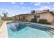 Relax in this backyard oasis featuring a private pool, patio area, and lush landscaping at 15619 N 58Th Ave, Glendale, AZ 85306