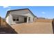 Spacious backyard with covered patio, block wall, and room for personalization and landscaping at 16575 N Lunar St, Maricopa, AZ 85138