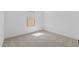 Empty bedroom with neutral carpet, white trim, and a window with blinds at 16575 N Lunar St, Maricopa, AZ 85138