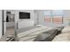 Bright bedroom featuring two windows, a TV, closet and a stylish bed and bedding at 16575 N Lunar St, Maricopa, AZ 85138