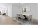 Tastefully decorated dining room featuring a contemporary table set with elegant chairs and modern art at 16575 N Lunar St, Maricopa, AZ 85138