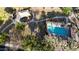 Aerial view featuring a community pool, a playground, walking paths, and lush landscaping with trees at 1677 W Seagull Ct, Chandler, AZ 85286