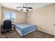 Well-lit bedroom with bed, desk, and minimalist decor for comfortable living at 1677 W Seagull Ct, Chandler, AZ 85286