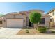 Charming single-Gathering home with a low-maintenance desert-style front yard and a two-car garage at 1677 W Seagull Ct, Chandler, AZ 85286
