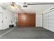 Organized garage space with storage cabinets and ample room for vehicles at 1677 W Seagull Ct, Chandler, AZ 85286