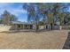 Expansive backyard with gravel, a covered patio, and storage sheds on a sunny day at 1719 E Pinchot Ave, Phoenix, AZ 85016