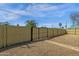 Well-maintained wooden fence encloses the spacious gravel backyard at 1719 E Pinchot Ave, Phoenix, AZ 85016
