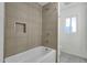 Modern bathroom features a tiled shower, niche, and fixtures at 1719 E Pinchot Ave, Phoenix, AZ 85016