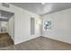Well-lit bedroom with hardwood floors and built-in storage cabinets and drawers at 1719 E Pinchot Ave, Phoenix, AZ 85016