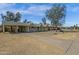 View of the exterior of a well maintained home with carport and desert landscaping under a bright blue sky at 1719 E Pinchot Ave, Phoenix, AZ 85016