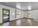Spacious living room featuring wood flooring and lots of natural light through large windows at 1719 E Pinchot Ave, Phoenix, AZ 85016