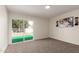 Bedroom with carpet flooring and backyard view through the sliding door at 1750 W Mohawk Ln, Phoenix, AZ 85027