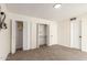 Bedroom featuring carpet flooring, and closets with bi-fold doors at 1750 W Mohawk Ln, Phoenix, AZ 85027